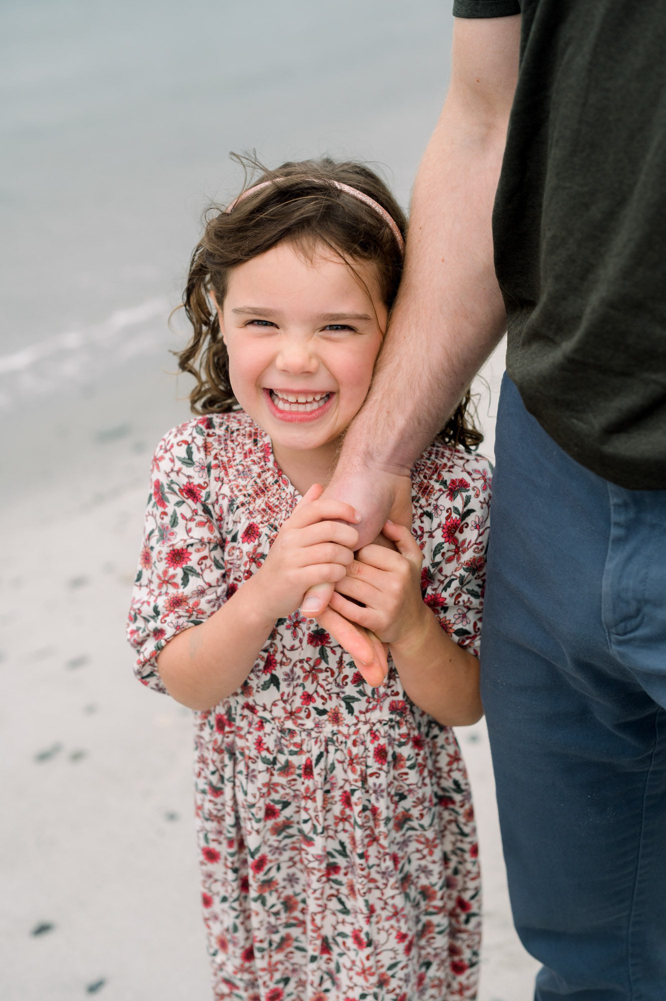Family beach photos, little girl holding dad's hand
