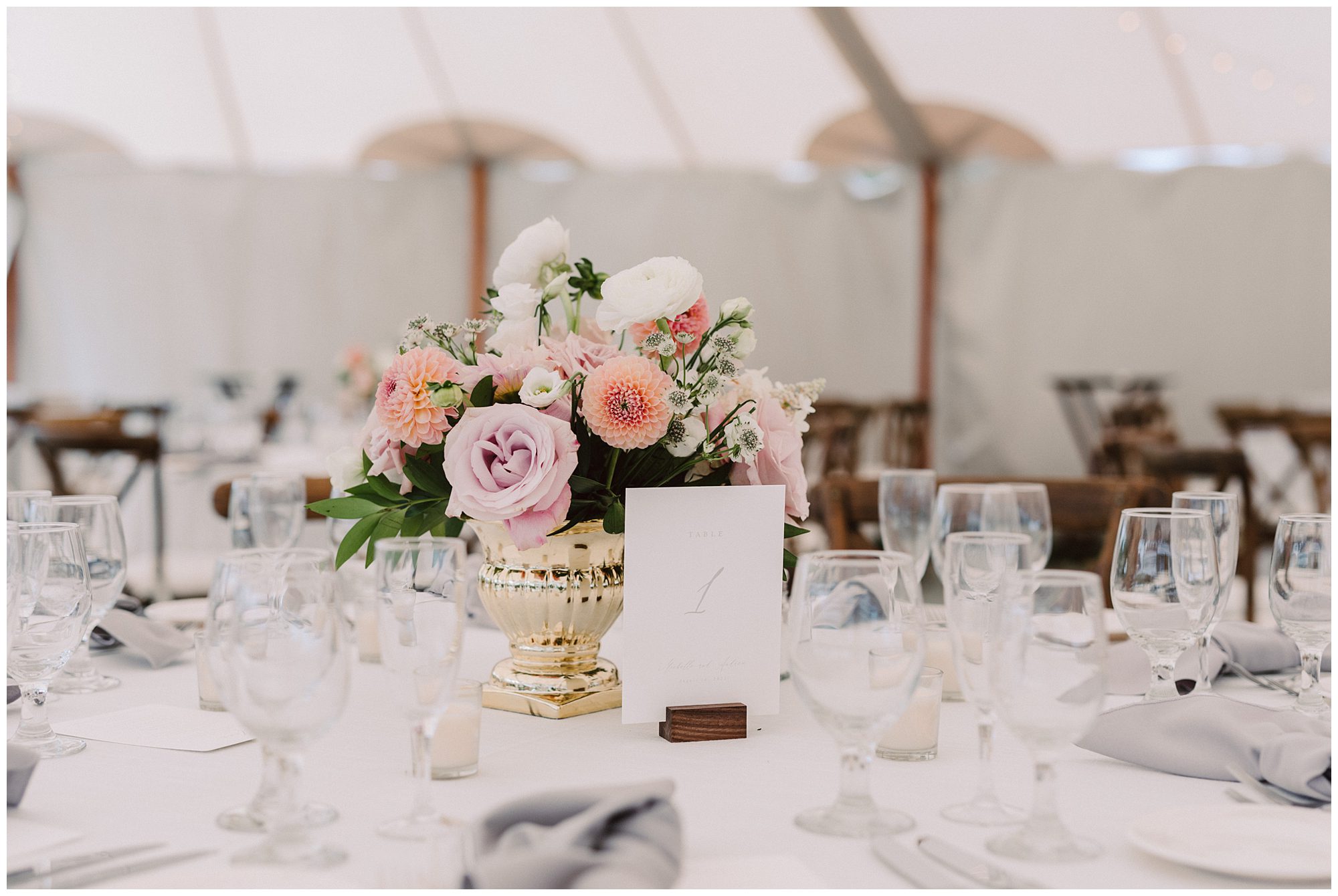 Floral centerpieces at Wentworth country Club tented Wedding