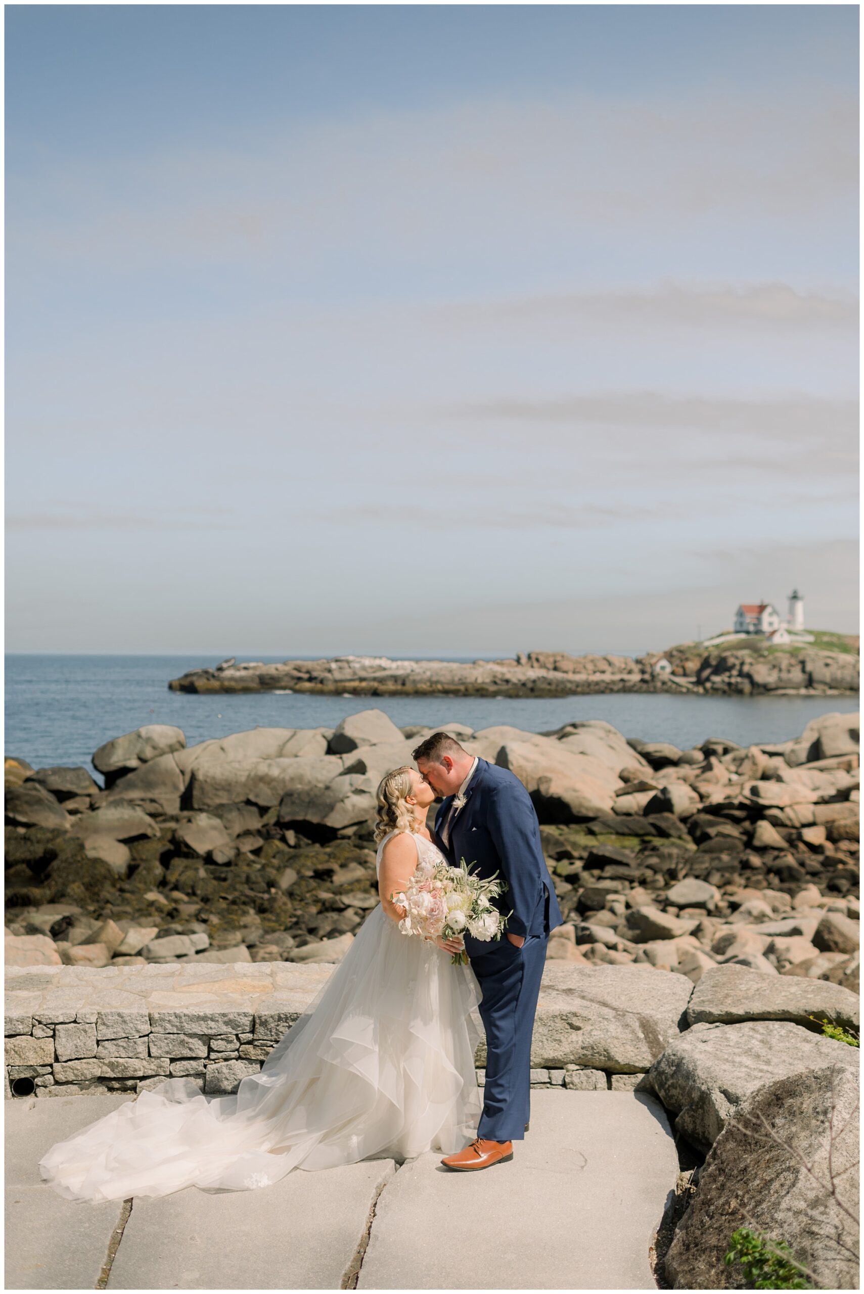Wedding portraits of Hailey & Mike overlooking Nubble Lighthouse in York Maine.