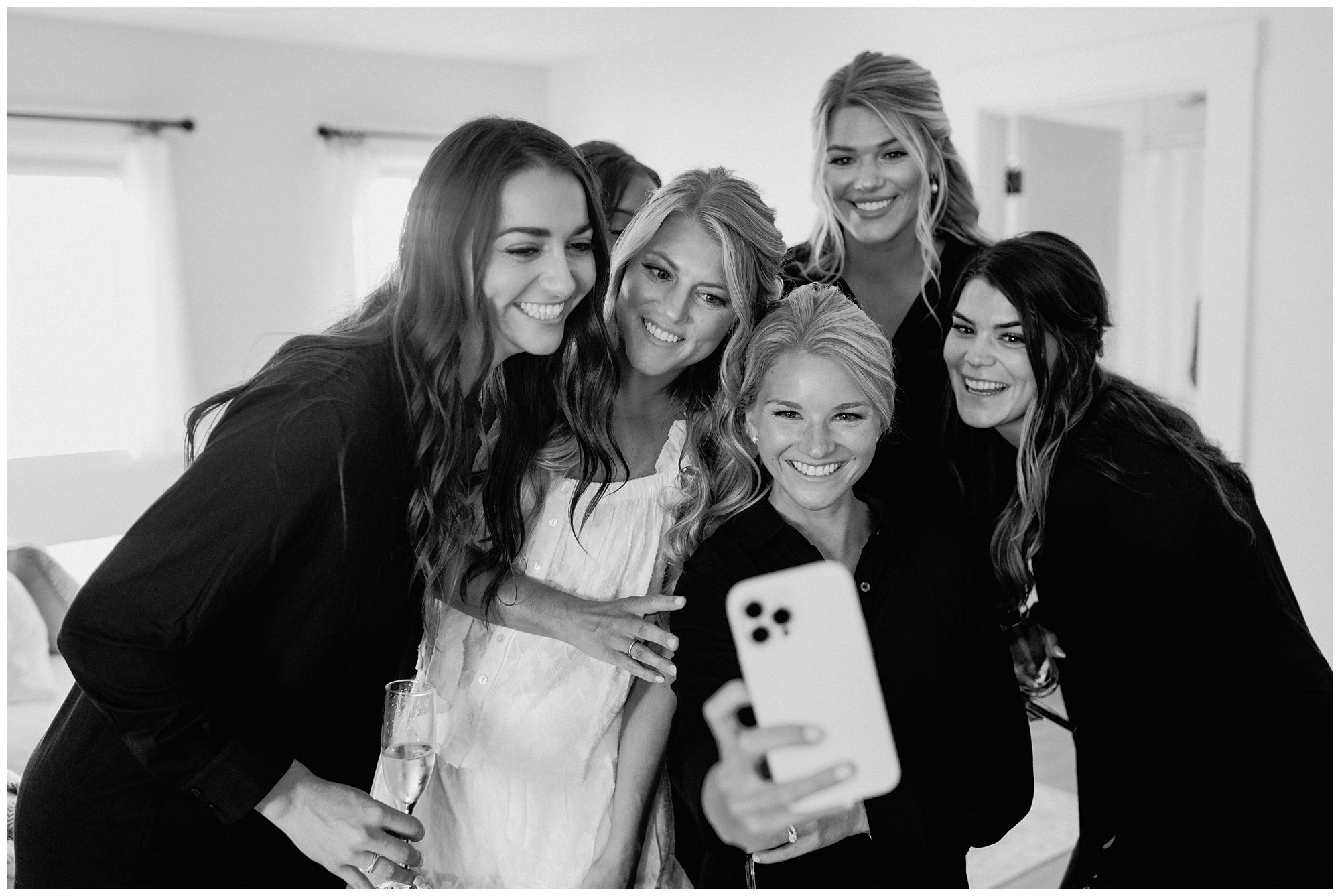 Bride and bridesmaids take a selfie