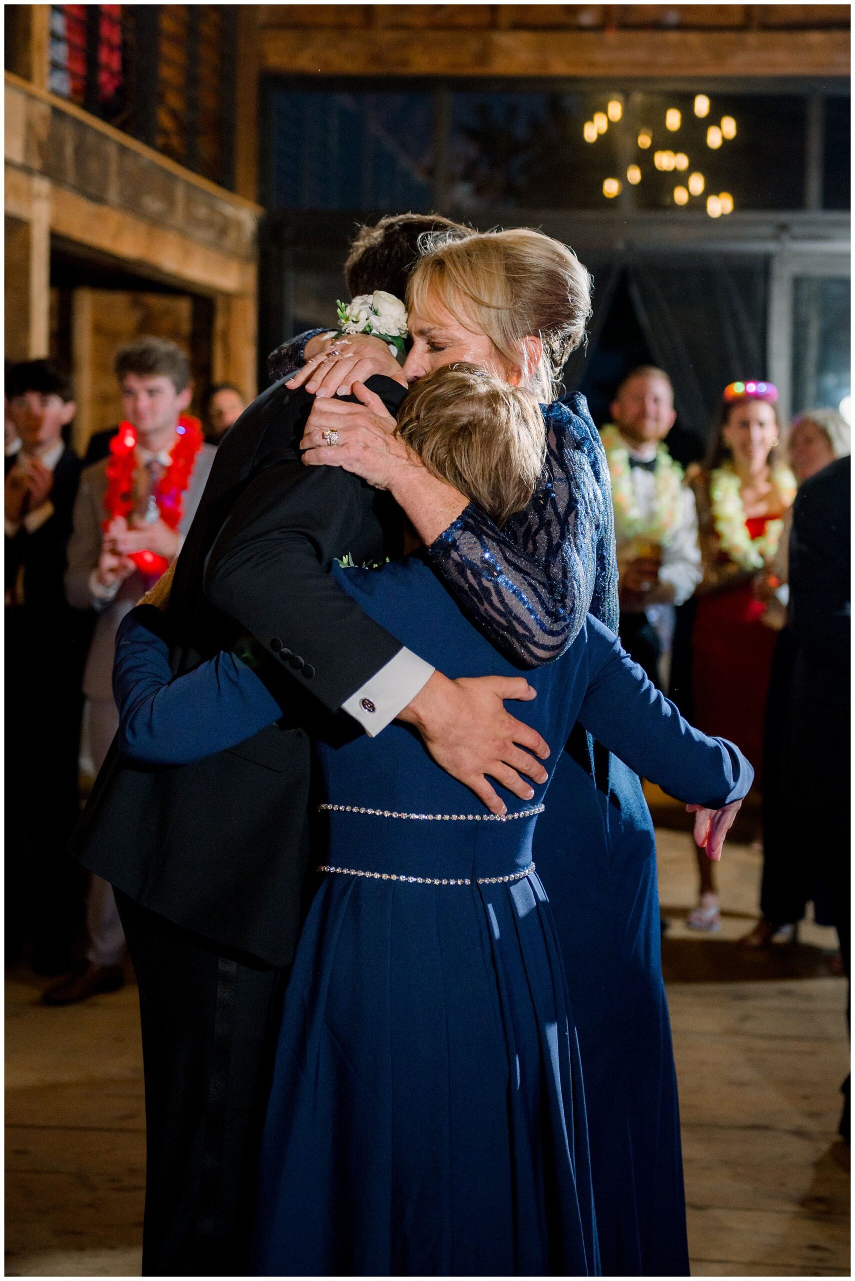 family hugs during reception
