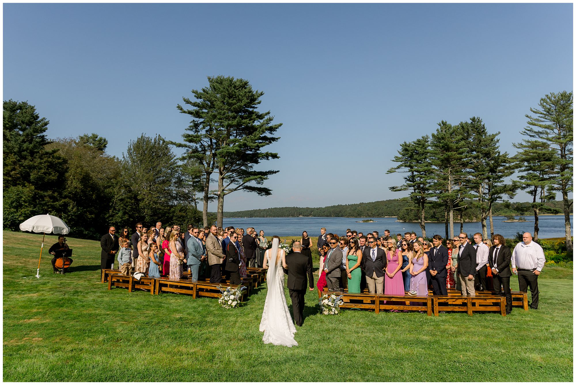 Wedding ceremony overlooking waterfront at 1774 Inn wedding in Phippsburg, Maine